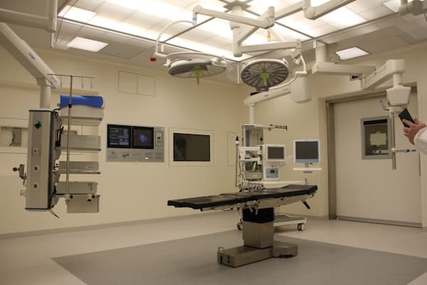 Dental professional performing laser surgery with advanced equipment